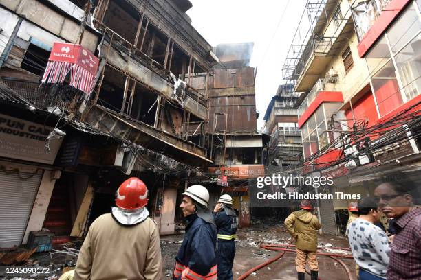 View of burnt and damaged shops after a major fire broke out at Bhagirath palace market, wholesale hub for electrical household goods, on November...