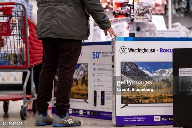 Shopper views televisions for sale on Black Friday in Chicago, Illinois, US, on Friday, Nov. 25, 2022. US retailers are bracing for a...