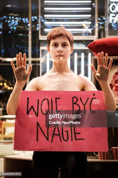 Extinction Rebellion protesting against Black Friday &amp; Fast Fashion in Warsaw, Poland. Climate activists gathered in front of one of Warsaw city...