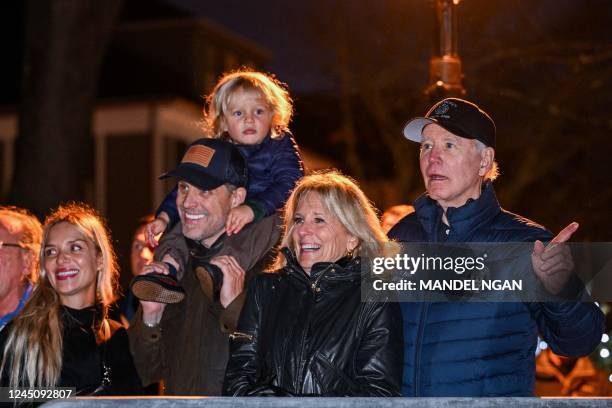 President Joe Biden watches a Christmas tree lighting ceremony with First Lady Jill Biden, son Hunter Biden, grandson Beau, and daughter-in-law...