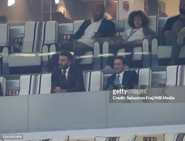 David Beckham and his agent Dave Gardner watch on during the FIFA World Cup Qatar 2022 Group B match between England and USA at Al Bayt Stadium on...