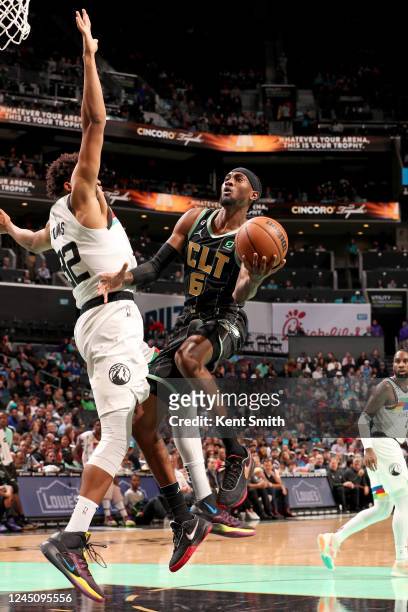 Jalen McDaniels of the Charlotte Hornets drives to the basket against the Minnesota Timberwolves on November 25, 2022 at Spectrum Center in...