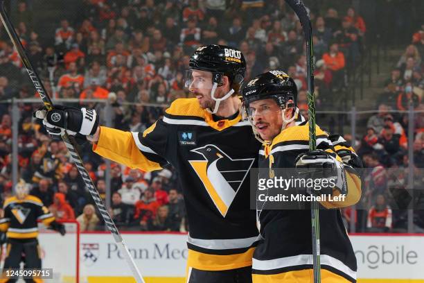 Sidney Crosby of the Pittsburgh Penguins celebrates with Marcus Pettersson after scoring a goal against the Philadelphia Flyers in the first period...