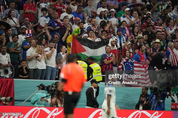 Supporter unfurls a Palestinian flag during the FIFA World Cup Qatar 2022 Group B match between England and USA at Al Bayt Stadium in Al Khor, Qatar...