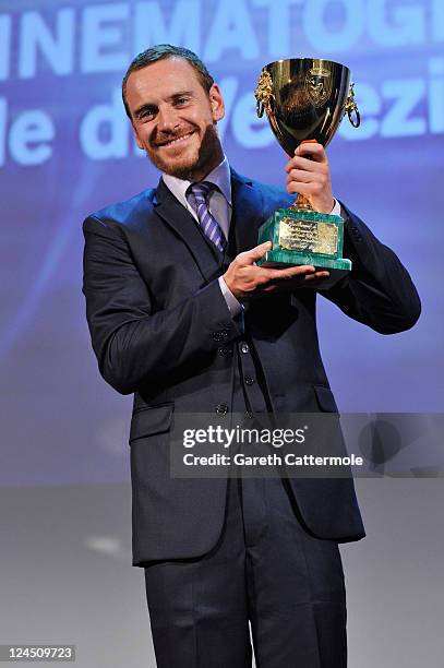 Actor Michael Fassbender of "Shame" accepts the Coppa Volpi for Best Actor during the Closing Ceremony during the 68th Venice Film Festival at...