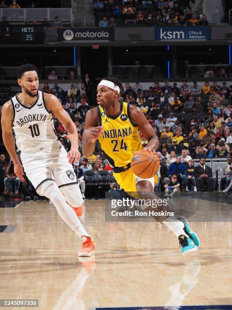 Buddy Hield of the Indiana Pacers drives to the basket during the game against the Brooklyn Nets on November 25, 2022 at Gainbridge Fieldhouse in...