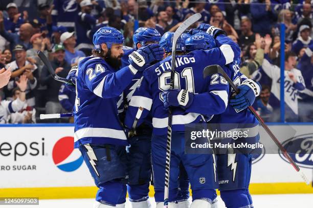 Alex Killorn of the Tampa Bay Lightning celebrates a goal with teammates Zach Bogosian, Steven Stamkos, Nicholas Paul and Ian Cole against the St...