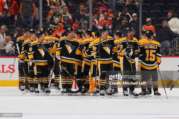 The Pittsburgh Penguins celebrate their win against the Philadelphia Flyers at the Wells Fargo Center on November 25, 2022 in Philadelphia,...