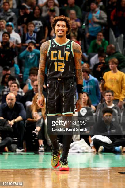 Kelly Oubre Jr. #12 of the Charlotte Hornets smiles during the game against the Minnesota Timberwolves on November 25, 2022 at Spectrum Center in...