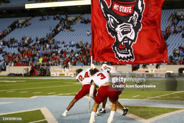 Derrek Pitts Jr. Of the North Carolina State Wolfpack celebrates after an overtime win after a football game between the North Carolina Tar Heels and...