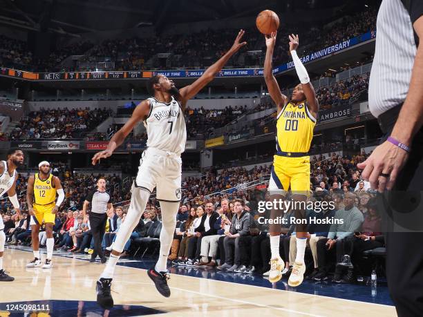 Bennedict Mathurin of the Indiana Pacers shoots a three point basket during the game against the Brooklyn Nets on November 25, 2022 at Gainbridge...