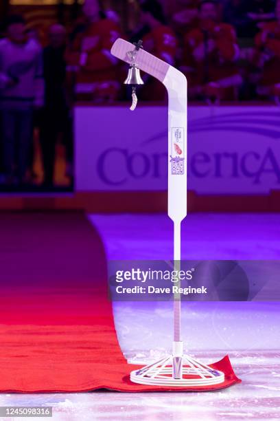 Bell hangs from a pink goalie stick for the ceremonial face-off at Hockey Fights Cancer Night before an NHL game between the Detroit Red Wings and...