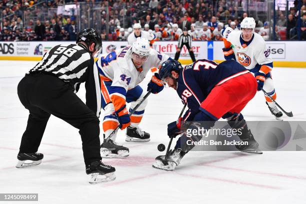 Boone Jenner of the Columbus Blue Jackets and Jean-Gabriel Pageau of the New York Islanders battle for the puck in a face-off during the second...