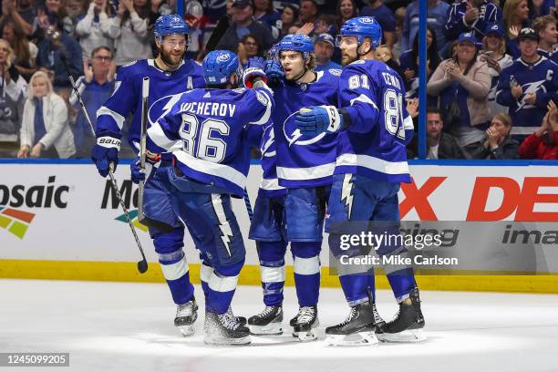 Brandon Hagel of the Tampa Bay Lightning celebrates a goal with teammates Brayden Point, Victor Hedman, Nikita Kucherov, and Erik Cernak against the...