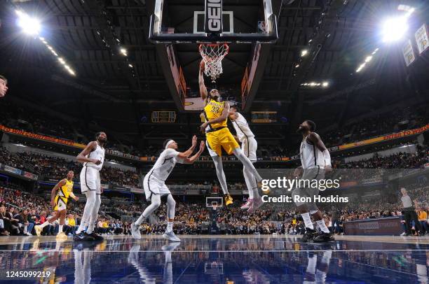 Myles Turner of the Indiana Pacers drives to the basket during the game against the Brooklyn Nets on November 25, 2022 at Gainbridge Fieldhouse in...