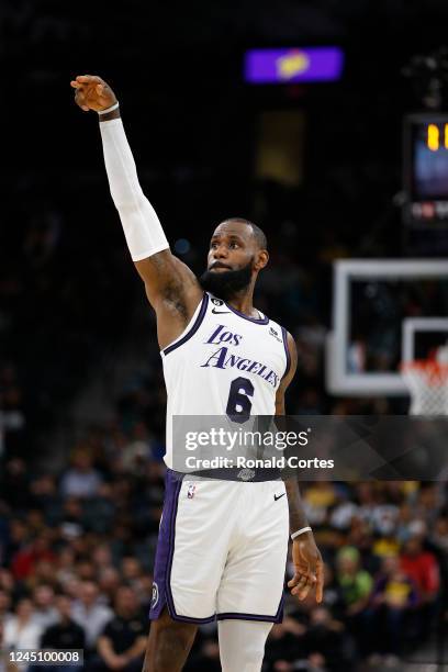 LeBron James of the Los Angeles Lakers strikes a pose after hitting a three against the San Antonio Spurs in the first half at AT&T Center on...