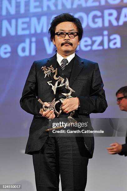 Director Sion Sono of "Himizu" accepts the Marcello Mastroianni Award for Best Young Actor or Actress on behalf of Shota Sometani and Fumi Nikaido...