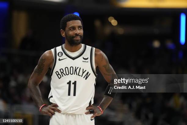 Kyrie Irving of the Brooklyn Nets smiles during the game against the Indiana Pacers on November 25, 2022 at Gainbridge Fieldhouse in Indianapolis,...