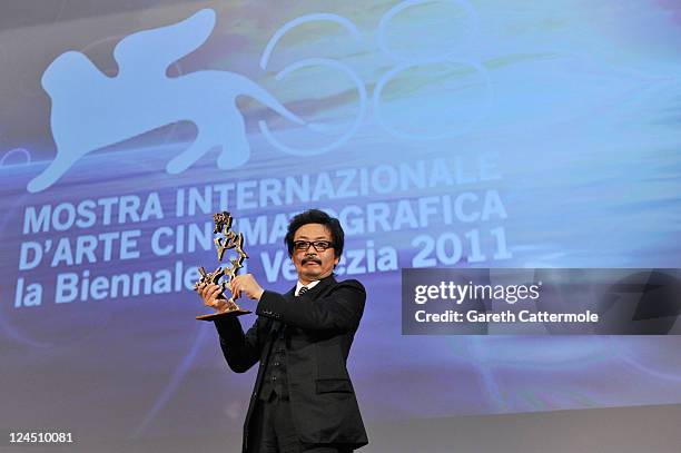 Director Sion Sono of "Himizu" accepts the Marcello Mastroianni Award for Best Young Actor or Actress on behalf of Shota Sometani and Fumi Nikaido...