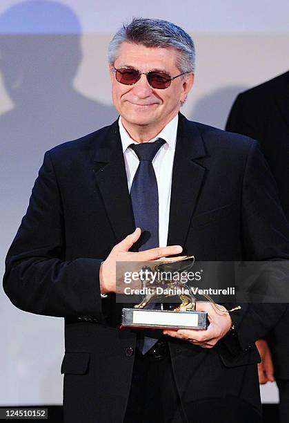 Director Aleksandr Sokurov of 'Faust' accepts the Golden Lion for best film during the Closing Ceremony Inside during the 68th Venice International...