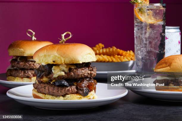 Left to right: La Hamburguesa , the Frenchie and the Ghostburger sub Veggie Patty with Crinkle Cuts and Ghostclaw cocktail and its can at Ghostburger...