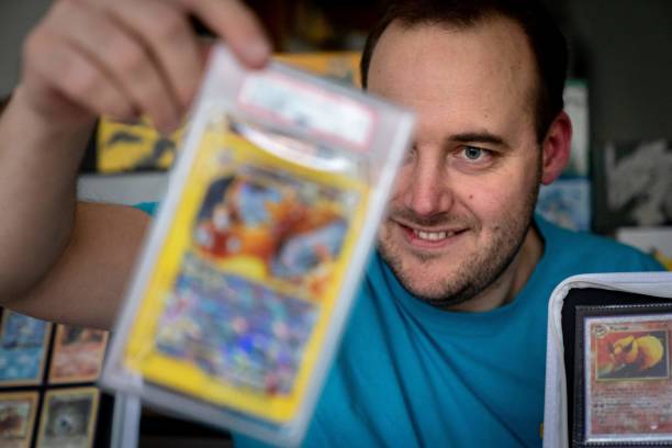 Jens Ishoey Prehn poses with some of his pokemon cards in Niva, eastern Denmark on November 25, 2022. - Jens Ishoey Prehn and his brother are...