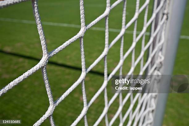 soccer goal with side-netting - fussballtor stockfoto's en -beelden