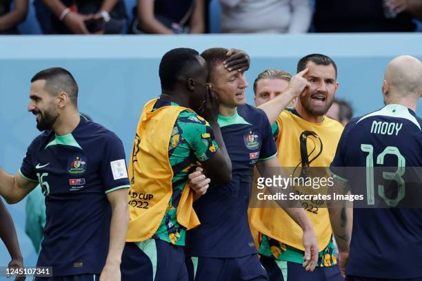 Mitchell Duke of Australia celebrates 1-0 with teammates during the World Cup match between Tunisia v Australia at the Al Janoub Stadium on November...