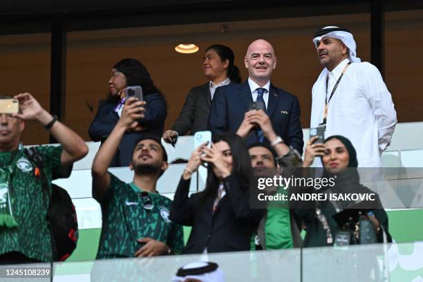 President Gianni Infantino and Qatar's Prime Minister Khalid bin Khalifa bin Abdulaziz Al Thani attend the Qatar 2022 World Cup Group C football...
