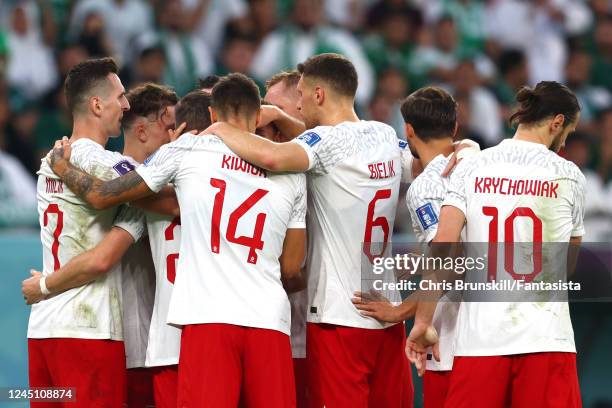 Poland celebrate the first goal scored by Piotr Zielinski of Poland during the FIFA World Cup Qatar 2022 Group C match between Poland and Saudi...