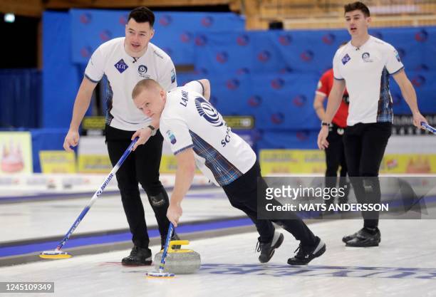 Scotland's Hammy McMillan and Bobby Lammie compete during the men's gold medal match between Scotland and Switzerland at the European Curling...