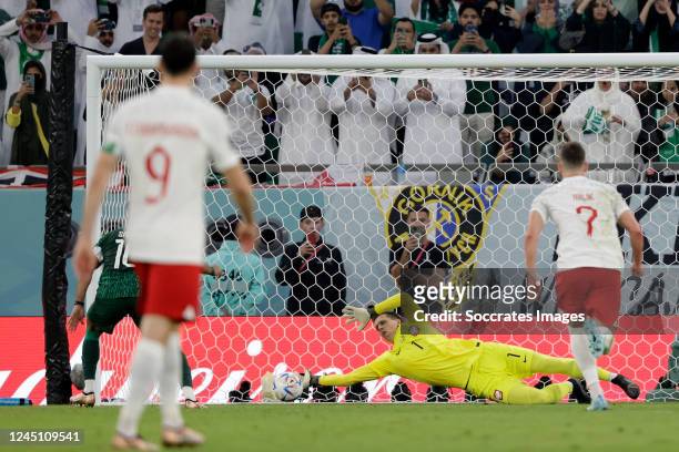 Wojciech Szczesny of Poland saves a penalty from Salem Al Dawsari of Saudi Arabia during the World Cup match between Poland v Saudi Arabia at the...