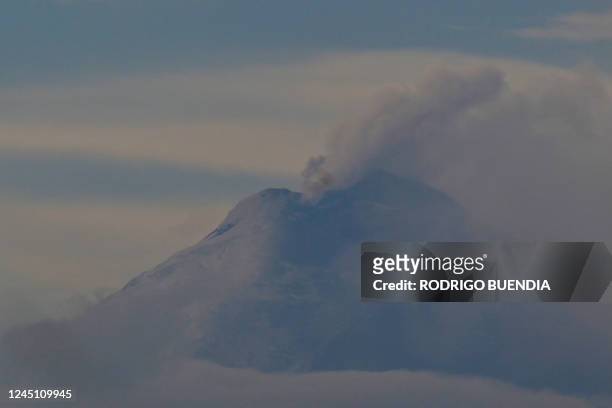 The Cotopaxi volcano emits ash and gases, as seen from Quito on November 26, 2022.