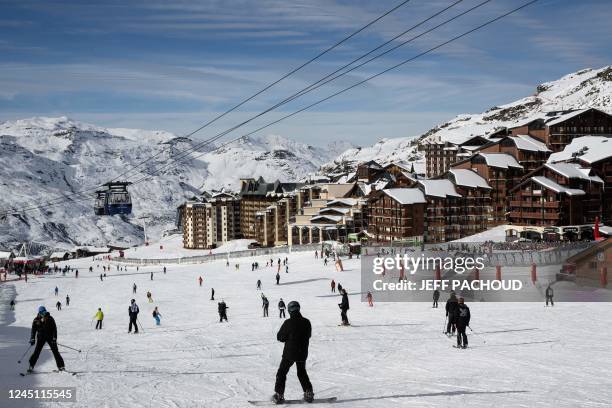 Skiers enjoy snowy slopes at the Val Thorens French resort on its opening day on November 26, 2022.