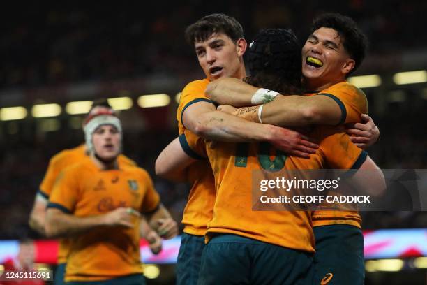 Australia's Lachlan Lonergan celebrates with teammates after scoring the winning try during the Autumn Nations Series International rugby union match...