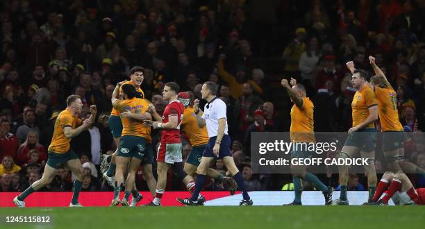 Australia players celebrate after the final whistle of the Autumn Nations Series International rugby union match between Wales and Australia at the...