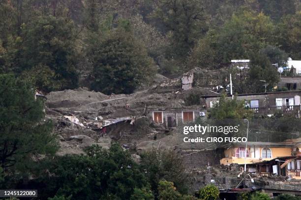 This photograph taken on November 26, 2022 shows damaged buildings following a landslide caused by heavy rains in Casamicciola on the island of...