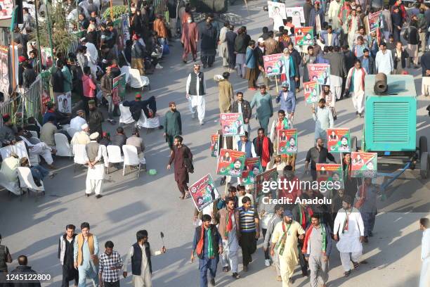 Supporters of former Pakistani Prime Minister Imran Khan, head of the Pakistan Tehrik-e-Insaf party, gather to attend an anti-government rally in...