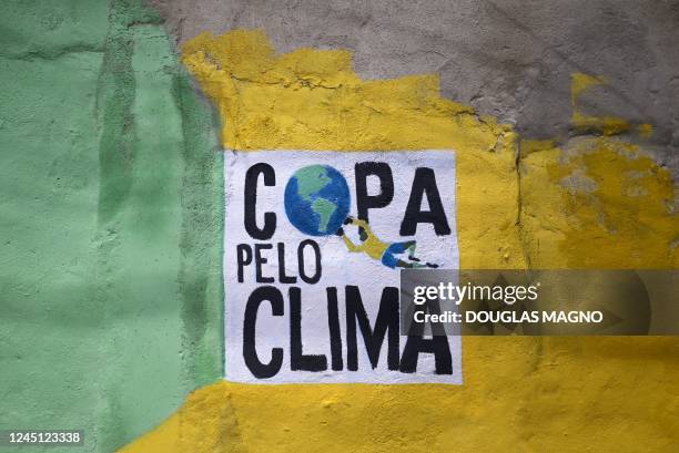 Wall painted with the words Cup for the Climate is pictured during an artistic intervention in Belo Horizonte, state of Minas Gerais, Brazil, on...