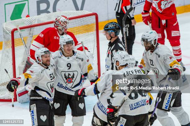 David Desharnais of HC Fribourg-Gotteron celebrates his goal with teammates during the Ice Hockey National League match between Lausanne HC and HC...