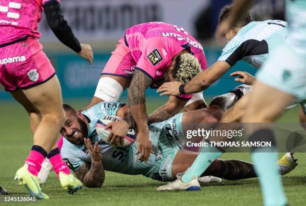 Toulon's Georgian prop Beka Gigashvili is tackled during the French Top14 rugby union match between Stade Francais and RC Toulon, at Jean Bouin...