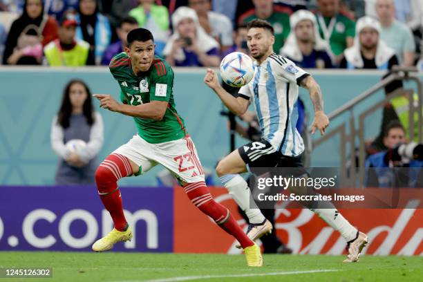 Jesus Gallardo of Mexico, Gonzalo Montiel of Argentina during the World Cup match between Argentina v Mexico at the Lusail Stadium on November 26,...