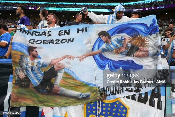 Fans of Argentina with a Lionel Messi and Diego Maradona banner during the FIFA World Cup Qatar 2022 Group C match between Argentina and Mexico at...