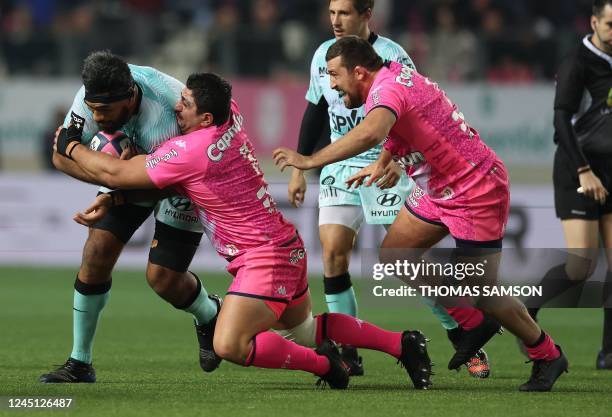 Toulons Brian Alainnuuese is tackled by Stade Français French Sekou Macalou during the French Top14 rugby union match between Stade Francais and RC...