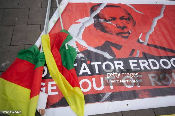 A banner of &quot; Dictator Erdogan&quot; with several Kurdish flags are seen during the protest condemning the latest Turkish attack against Kurdish...