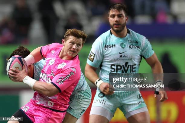 Stade Francais' South African scrum-half James Hall passes the ball during the French Top14 rugby union match between Stade Francais and RC Toulon,...