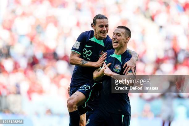 Mitchell Duke of Australia celebrates after scoring his team's first goal with Jackson Irvine of Australia during the FIFA World Cup Qatar 2022 Group...