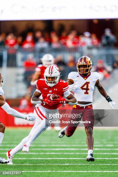 Wisconsin wide receiver Keontez Lewis runs for extra yards following a reception during a college football game between the University of Wisconsin...