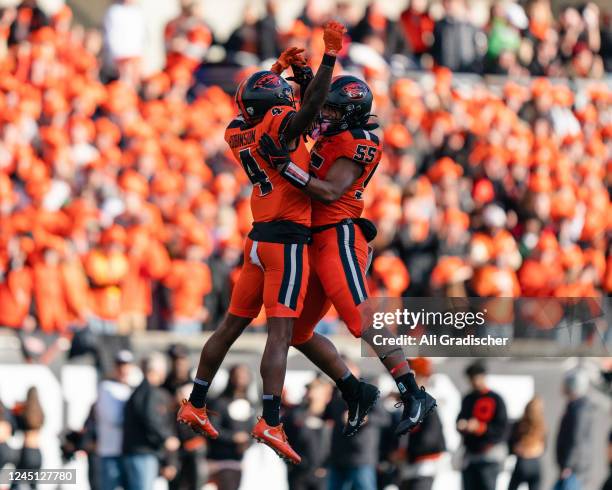 Defensive back Jaden Robinson and linebacker Easton Mascarenas-Arnold of the Oregon State Beavers celebrate during the first half of the game against...