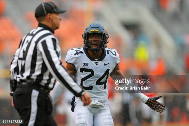 Safety Marcis Floyd of the West Virginia Mountaineers reacts to a flag after breaking up a pass to wide receiver Braydon Johnson of the Oklahoma...